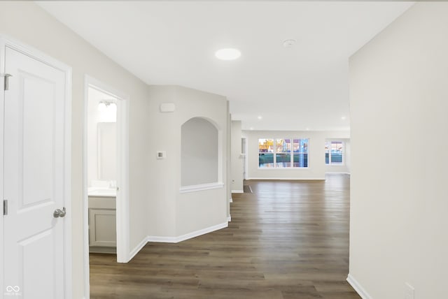 hallway with dark hardwood / wood-style floors