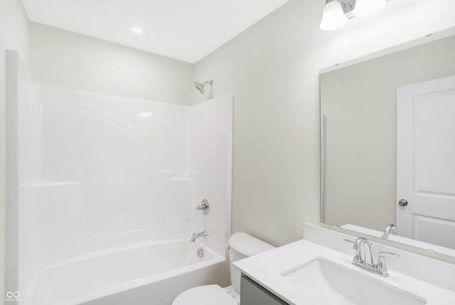 full bathroom featuring shower / bath combination, toilet, and vanity