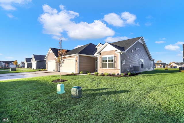 view of front of home with a front lawn, a garage, and cooling unit