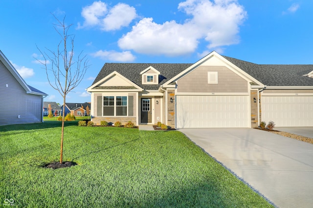 view of front facade with a garage and a front yard