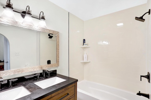 bathroom featuring vanity and shower / tub combination