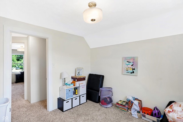 rec room featuring light carpet and lofted ceiling