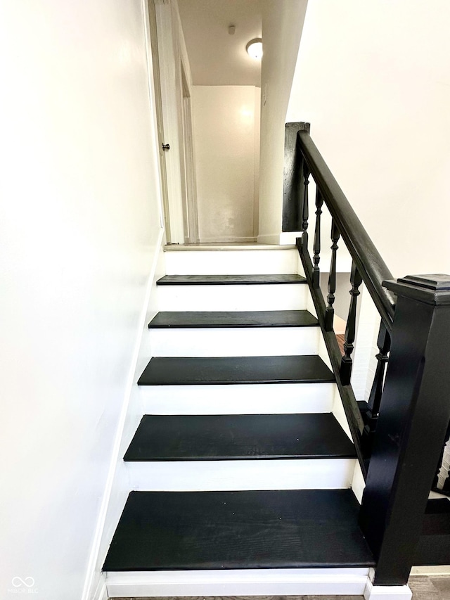 stairs featuring baseboards