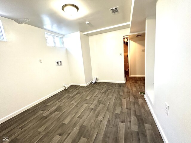 basement featuring dark hardwood / wood-style floors