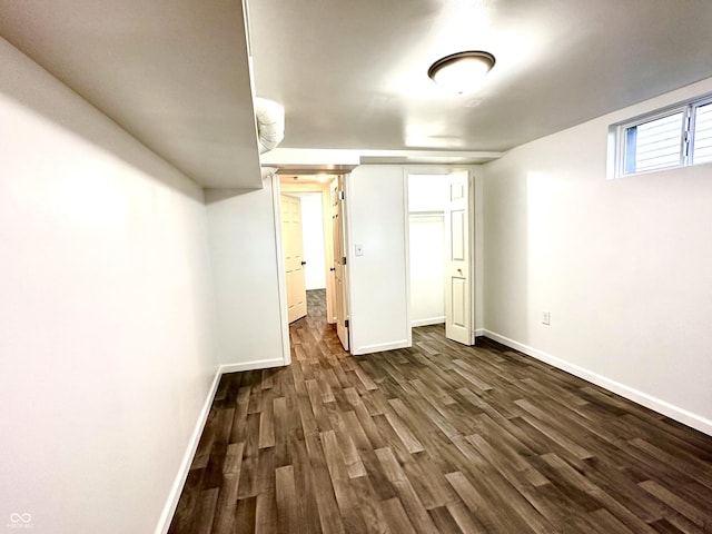 basement with dark wood finished floors and baseboards