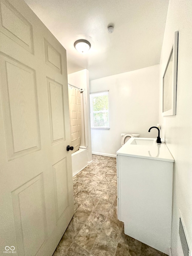 bathroom featuring vanity, tile patterned flooring, and shower / bath combination with curtain