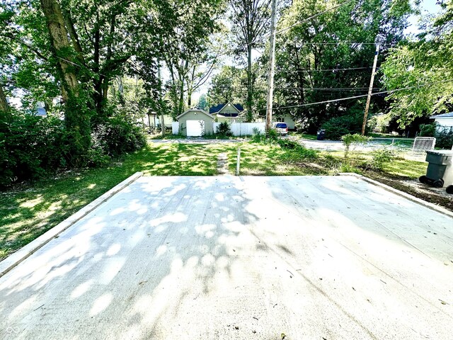 view of patio featuring an outbuilding