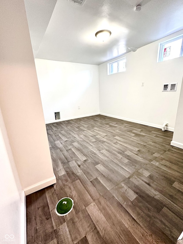 basement with dark wood finished floors and baseboards