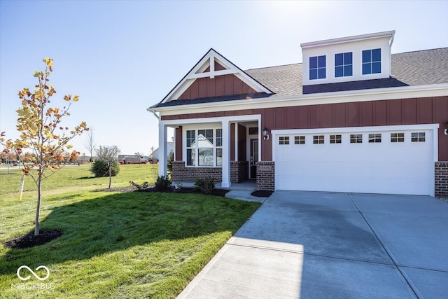 craftsman house with a front yard and a garage