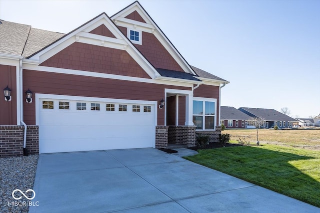 craftsman-style home with a front yard and a garage