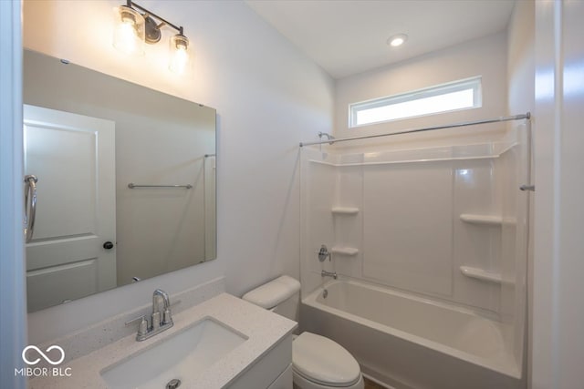 full bathroom featuring toilet, vanity, and  shower combination