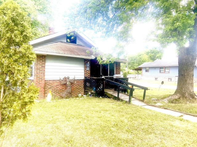 view of home's exterior featuring a yard