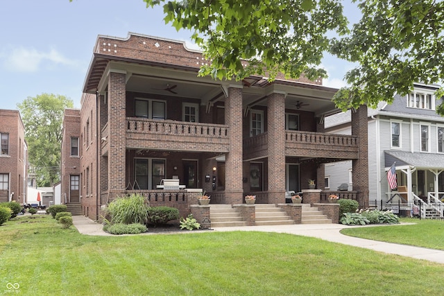 view of front of home featuring a balcony and a front lawn