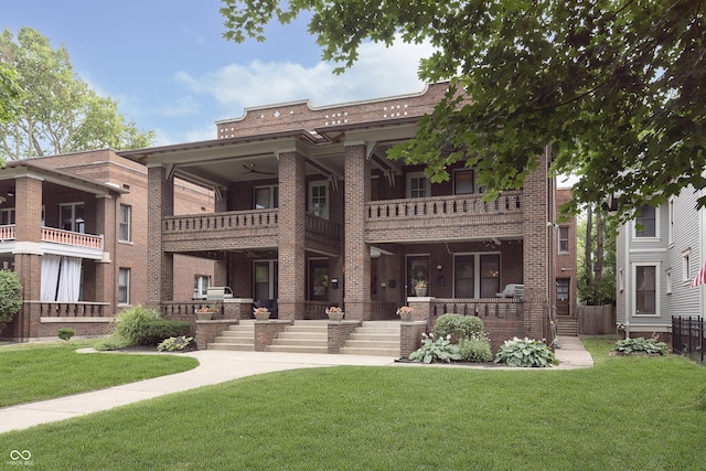 exterior space featuring covered porch and a front yard