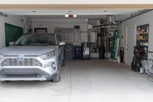 garage with a garage door opener and water heater