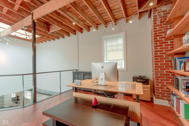 office area featuring beamed ceiling, light wood-type flooring, and wood ceiling