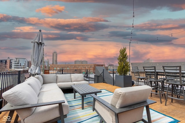 patio terrace at dusk featuring outdoor lounge area