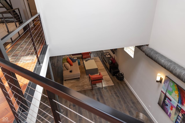 stairway with hardwood / wood-style floors