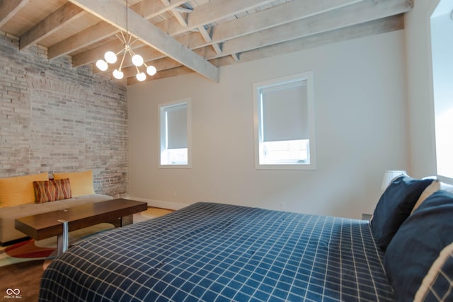 bedroom with beam ceiling, wooden ceiling, and a notable chandelier