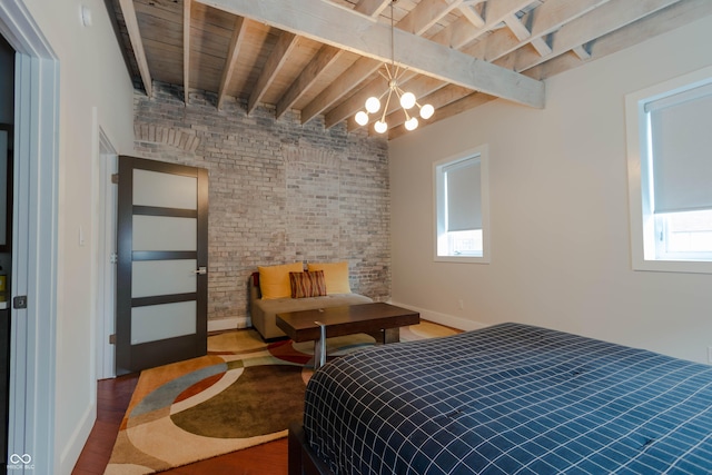 bedroom featuring beam ceiling, multiple windows, wooden ceiling, and brick wall