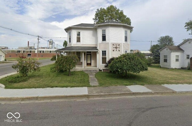 view of front of home with a front lawn and covered porch