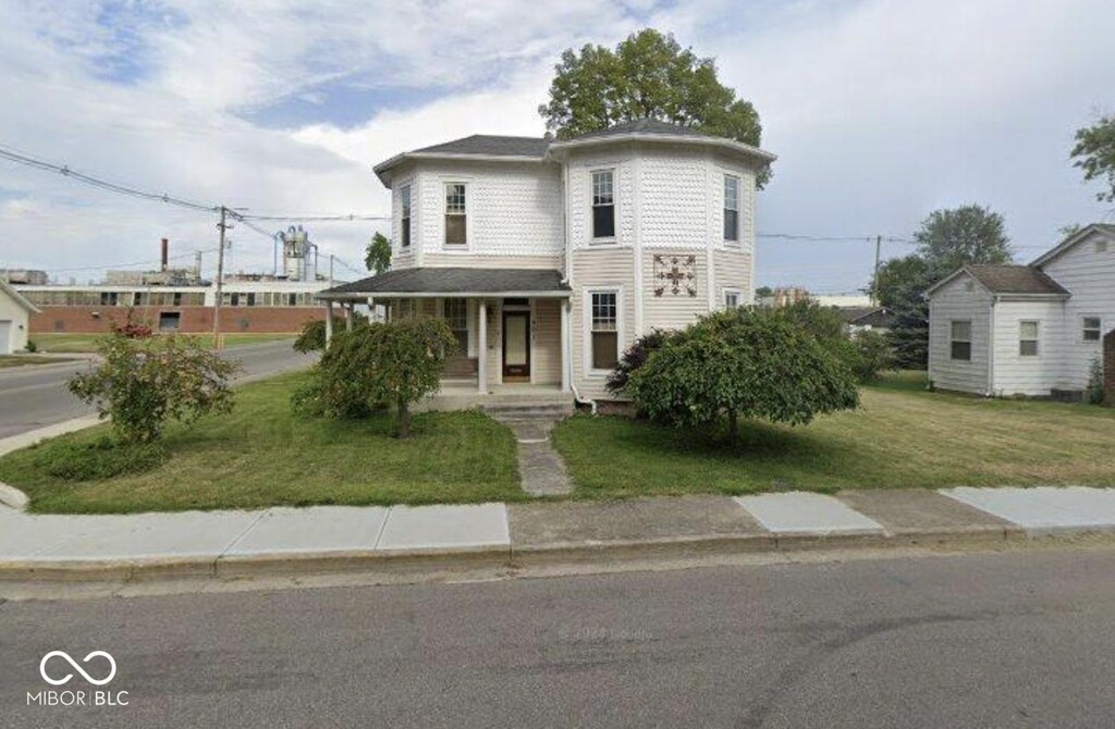 401 S Walnut St, Edinburgh, IN 46124 - view of front of home with a front lawn and covered porch