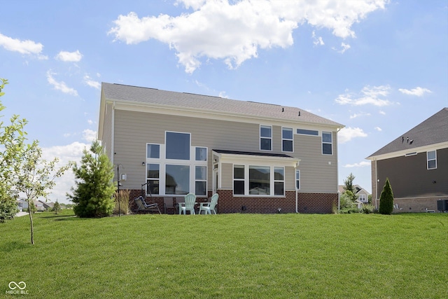 back of house with a yard and cooling unit