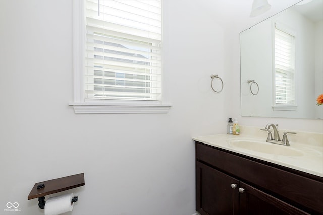 bathroom with plenty of natural light and vanity