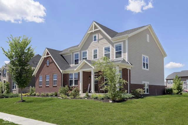 craftsman-style house featuring a front lawn