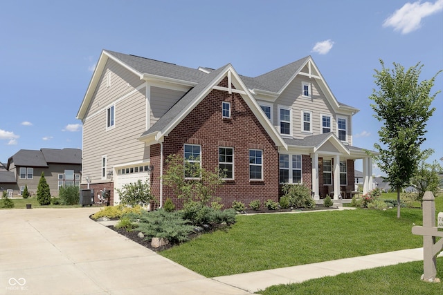 craftsman-style home with a front yard, a garage, and cooling unit