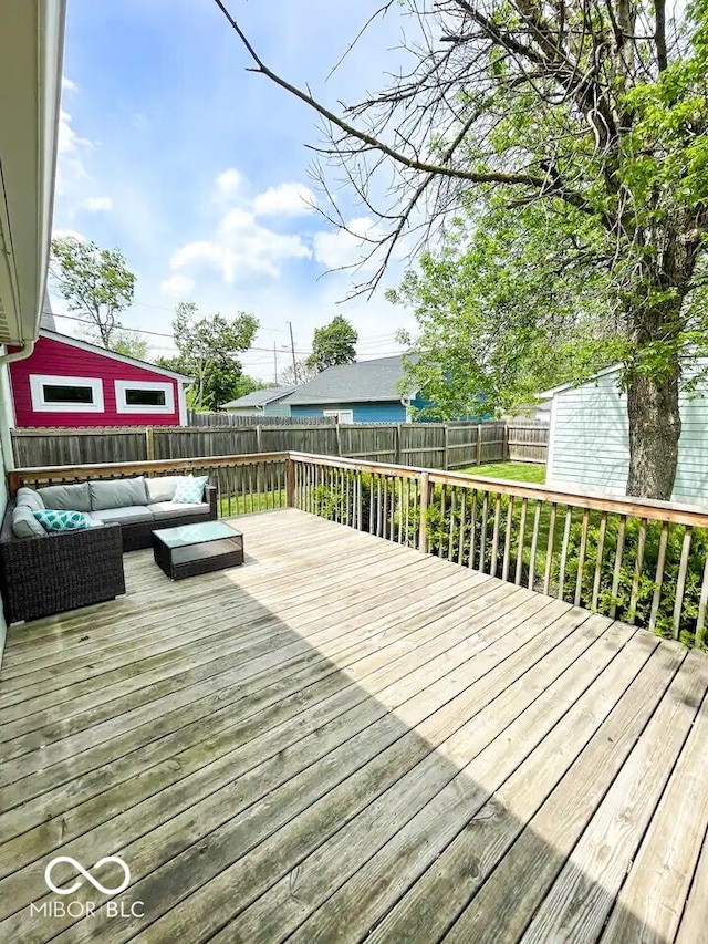 wooden terrace with outdoor lounge area