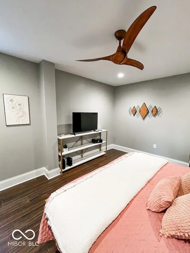 bedroom with ceiling fan and dark hardwood / wood-style floors