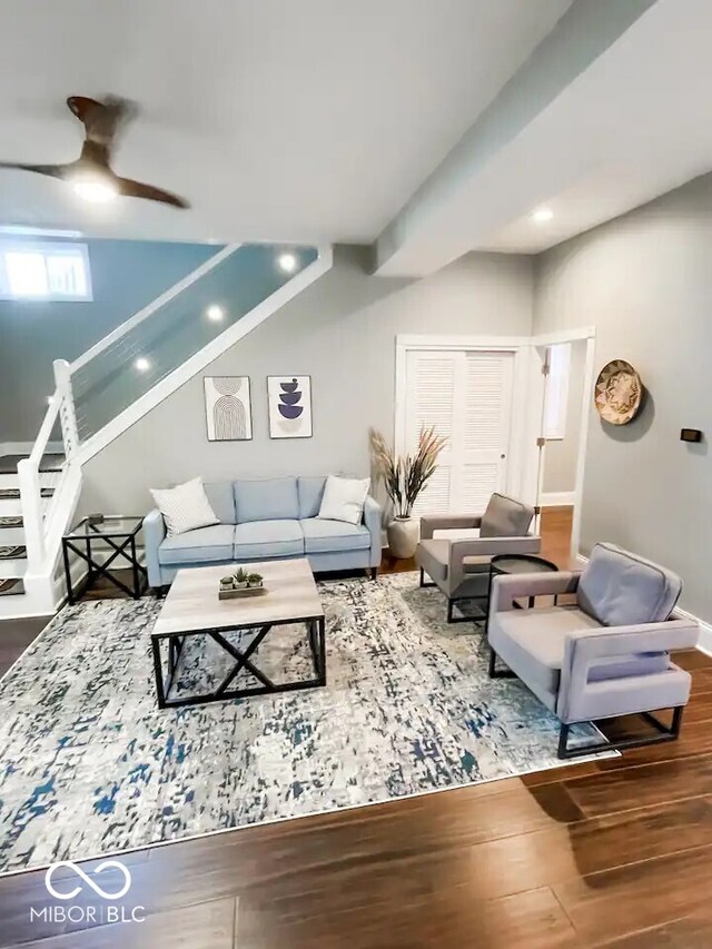 living room with ceiling fan and wood-type flooring