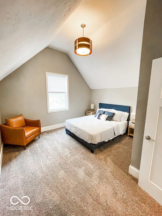 bedroom featuring carpet floors and vaulted ceiling