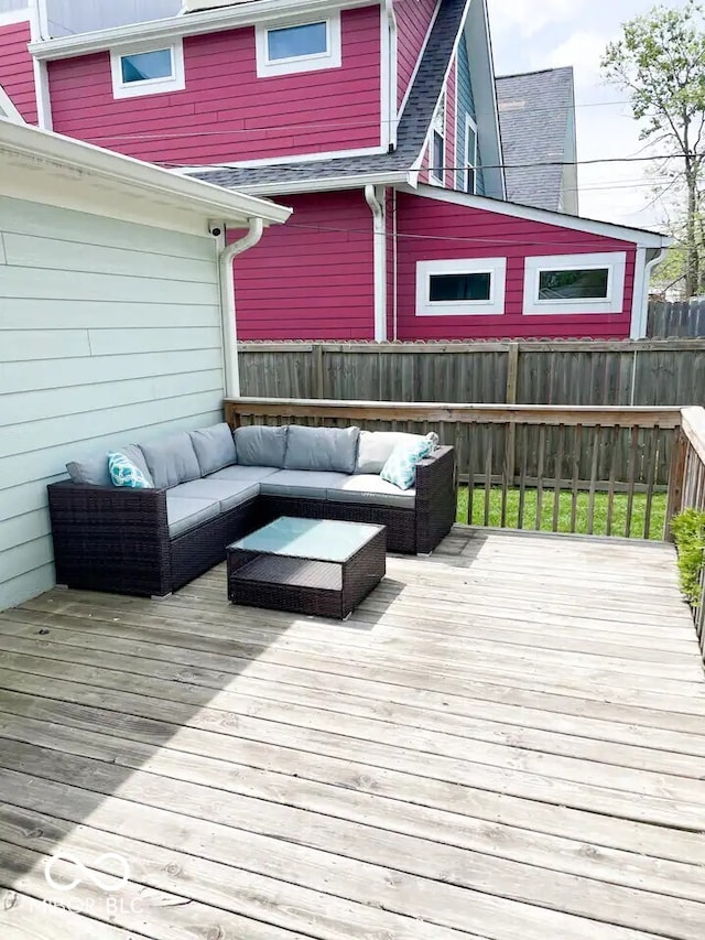 wooden terrace with an outdoor hangout area