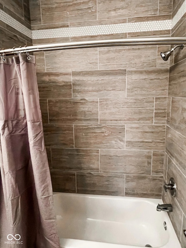 bathroom featuring shower / bath combo with shower curtain