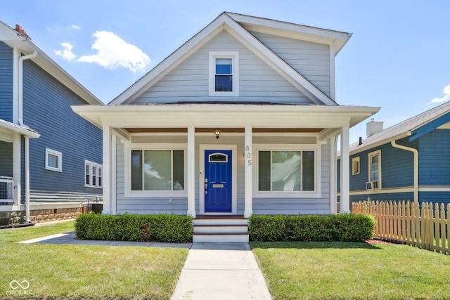 bungalow-style home featuring a front lawn