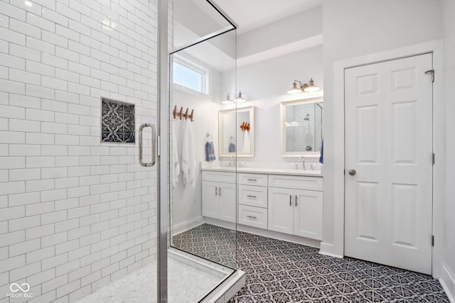 bathroom featuring tile patterned floors, vanity, and a shower with door