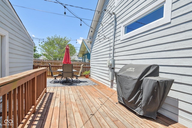 wooden deck featuring area for grilling