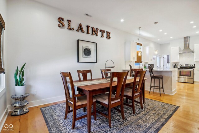 dining room featuring light wood-type flooring