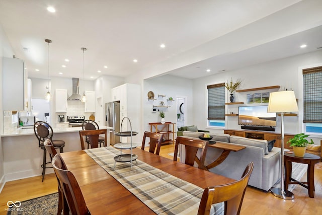 dining room with light wood-type flooring