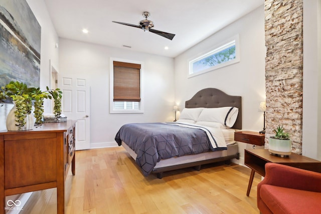 bedroom with light wood-type flooring and ceiling fan