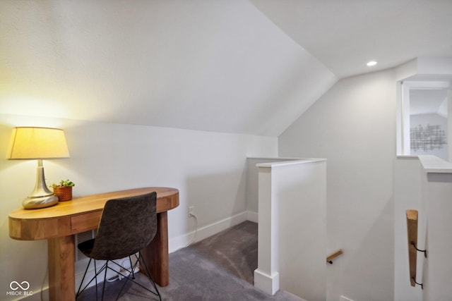 carpeted office with vaulted ceiling