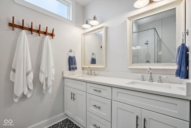 bathroom featuring vanity and a shower with door