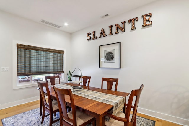 dining area featuring hardwood / wood-style floors