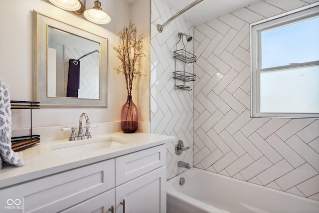 bathroom with vanity and tiled shower / bath combo