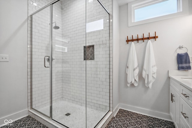 bathroom featuring tile patterned floors, vanity, and an enclosed shower