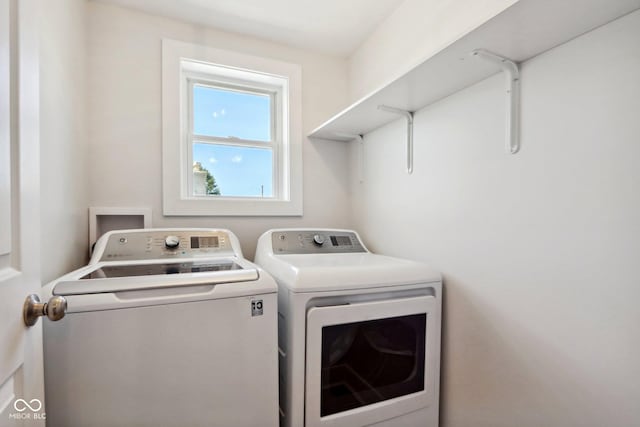 laundry room featuring separate washer and dryer