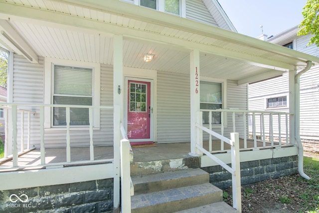 entrance to property featuring covered porch