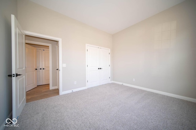 unfurnished bedroom with a closet and carpet